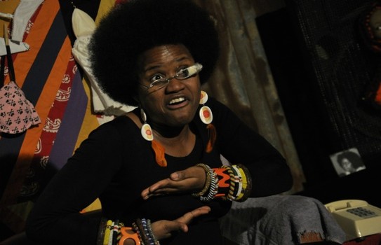 'Rie Shontel performs as her great-grandmother, Grandma Suga Babe, laying out the nitty-gritty of mammograms.